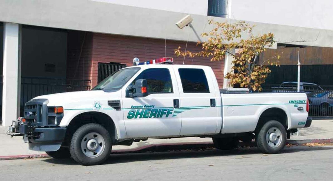 ZONE A Sonoma County Sheriff’s Office vehicle parked in a red zone under a surveillance camera.