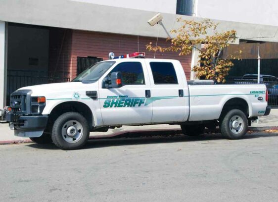 ZONE A Sonoma County Sheriff’s Office vehicle parked in a red zone under a surveillance camera.