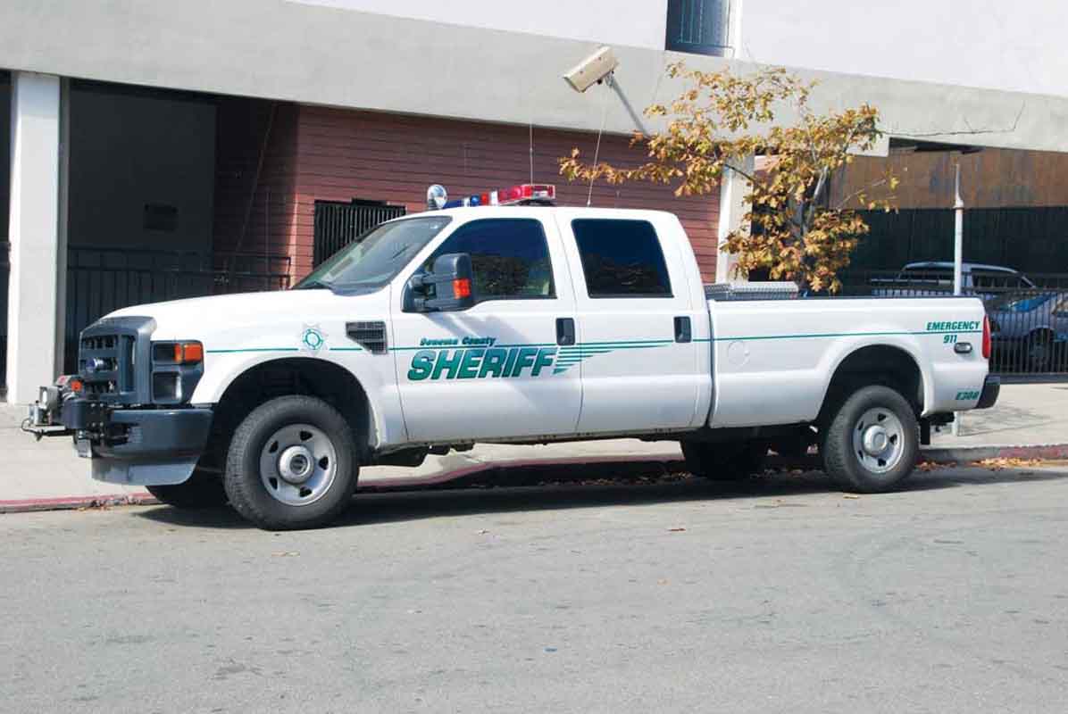 ZONE A Sonoma County Sheriff’s Office vehicle parked in a red zone under a surveillance camera.