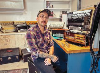 Conceptually, the accordion is quite ingenious, consisting of one set of piano keys and one set of buttons blocking reeds and forming chords on each of two banks of “harmonicas” held between a billows, sucking and compressing a captive wind.
