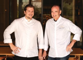 Reed Palmer and Charlie Palmer in white chef coats.