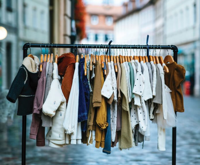 Children's clothing on display at a community clothing swap promoting free exchanges and sustainable reuse in Point Reyes Station.