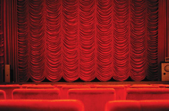 A closed red theater curtain