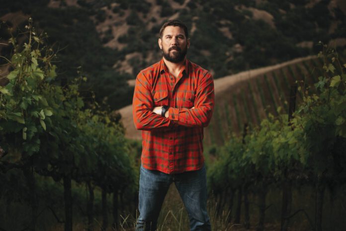 Clay Mauritson in a vineyard