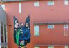 A colorful mural by artist Bud Snow covers the side of South Park Commons in Santa Rosa.