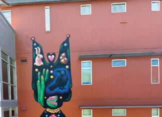 A colorful mural by artist Bud Snow covers the side of South Park Commons in Santa Rosa.
