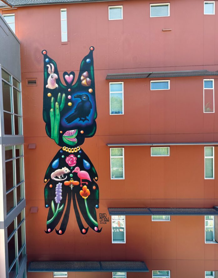 A colorful mural by artist Bud Snow covers the side of South Park Commons in Santa Rosa.