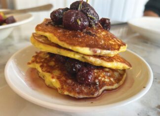 Oh My Darlin’, Yountville’s Clementine is Local Favorite A stack of pancakes topped with roasted grapes and served on a plate.