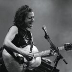 Folk, Yeah—Ani DiFranco Brings the Fun to GunBun Musician Ani DiFranco performing onstage with a guitar.