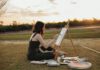 State of the Arts: Autumnal Culture and Creativity Artist painting on a canvas outdoors beside an easel at sunset