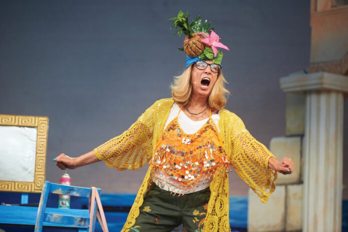 Lori Haley Fox onstage in costume during a performance of 'Mamma Mia1'