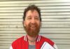 Cincinnatus Hibbard wearing a red and white jacket