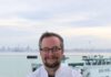 Regionality Reigns: Chris Ball Plans Perfect Last Meal A smiling man with graying hair, eyeglasses and a beard stands with his arms crossed wearing a white chef’s coat.