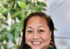 Count on It: Evelyn Mendez Puts SoCo Elections on Public View A smiling woman with long, straight dark hair is wearing gold jewelry and a green blouse.
